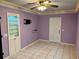 Bedroom with purple walls and tile floors at 512 Chamber Nw St, Port Charlotte, FL 33948