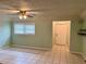 Bright living room with tile floors and neutral walls at 512 Chamber Nw St, Port Charlotte, FL 33948