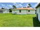 Large grassy backyard with a detached shed at 512 Chamber Nw St, Port Charlotte, FL 33948