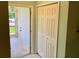 Small laundry area with storage and exterior access at 512 Chamber Nw St, Port Charlotte, FL 33948
