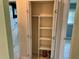 Shelved hall closet with additional storage at 512 Chamber Nw St, Port Charlotte, FL 33948