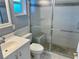 Bathroom with shower/tub combo and white vanity at 512 Chamber Nw St, Port Charlotte, FL 33948