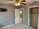 Bright bedroom with ceiling fan and a closet at 512 Chamber Nw St, Port Charlotte, FL 33948