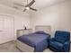 Bedroom with a full bed, ceiling fan, and armchair at 14131 Heritage Landing Blvd # 838, Punta Gorda, FL 33955