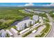 Aerial view of luxury condos near a waterway with parking at 14131 Heritage Landing Blvd # 838, Punta Gorda, FL 33955