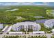 Aerial view of a condo community with water access and parking at 14131 Heritage Landing Blvd # 838, Punta Gorda, FL 33955