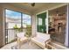 Screened balcony with wicker furniture, offering views and access to the kitchen and living area at 14131 Heritage Landing Blvd # 838, Punta Gorda, FL 33955