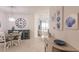 Bright dining area with coastal decor and view to living room at 14131 Heritage Landing Blvd # 838, Punta Gorda, FL 33955
