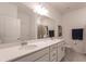 Double vanity bathroom with a large mirror and shower at 14131 Heritage Landing Blvd # 838, Punta Gorda, FL 33955