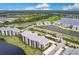Luxury community with lakefront and golf course views, featuring modern condo buildings at 14131 Heritage Landing Blvd # 838, Punta Gorda, FL 33955