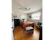 Well-lit bedroom with hardwood floors and ceiling fan at 7739 38Th N Pl, St Petersburg, FL 33709