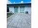 Private patio area with concrete pavers in front of the unit at 7739 38Th N Pl, St Petersburg, FL 33709
