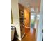 Clean hallway with wood floors and access to bathroom at 7739 38Th N Pl, St Petersburg, FL 33709