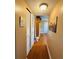 Hallway with wood floors and linen closet at 7739 38Th N Pl, St Petersburg, FL 33709