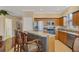 Eat-in kitchen with stainless steel appliances and a breakfast bar at 1751 Scarlett Ave, North Port, FL 34289