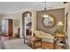 Cozy seating area showcases stylish furnishings, a decorative mirror, and hardwood flooring at 1751 Scarlett Ave, North Port, FL 34289