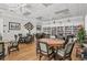 Reading room with hardwood floors, tables, chairs, bookshelves, and a Christmas tree at 1751 Scarlett Ave, North Port, FL 34289