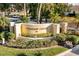 Fountain Court community entrance with lush landscaping and signage at 255 W End Dr # 2201, Punta Gorda, FL 33950