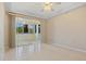 Bright bedroom with tile flooring and sliding doors to a private balcony at 255 W End Dr # 2201, Punta Gorda, FL 33950