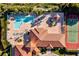 Aerial view of community pool, tennis courts, and clubhouse at 255 W End Dr # 2201, Punta Gorda, FL 33950