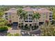 Two-story building with terracotta roofs and palm trees at 255 W End Dr # 2201, Punta Gorda, FL 33950