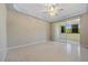 Spacious bedroom with tile floors and access to a private balcony at 255 W End Dr # 2201, Punta Gorda, FL 33950