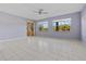 Spacious living room with tiled floors and sliding glass doors at 255 W End Dr # 2201, Punta Gorda, FL 33950