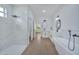 Elegant bathroom with soaking tub, walk-in shower, and modern fixtures at 16 Tee View Rd, Rotonda West, FL 33947