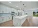 Spacious kitchen with island, stainless steel appliances, and backyard access at 16 Tee View Rd, Rotonda West, FL 33947