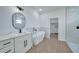 Modern bathroom with freestanding tub, walk-in shower and marble finishes at 16 Tee View Rd, Rotonda West, FL 33947