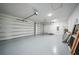 Spacious garage with overhead door and ample storage space at 16 Tee View Rd, Rotonda West, FL 33947