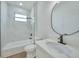 Clean bathroom with a tub, shower, and modern vanity at 16 Tee View Rd, Rotonda West, FL 33947