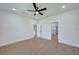 Spacious bedroom with hardwood floors and access to bathroom at 16 Tee View Rd, Rotonda West, FL 33947
