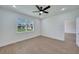 Bright bedroom with ceiling fan and hardwood flooring at 16 Tee View Rd, Rotonda West, FL 33947