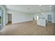 Spacious living area with hardwood floors and views to the backyard at 16 Tee View Rd, Rotonda West, FL 33947