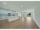 Modern kitchen with white cabinets, a large island, and stainless steel appliances at 16 Tee View Rd, Rotonda West, FL 33947