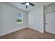 Bright bedroom featuring wood-look floors and a spacious closet at 16 Tee View Rd, Rotonda West, FL 33947