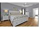 Spacious main bedroom with a king-size bed, two nightstands, and ample closet space at 24703 Buckingham Way, Punta Gorda, FL 33980