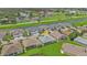 Aerial view of home community with golf course and lake at 24703 Buckingham Way, Punta Gorda, FL 33980