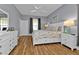 Main bedroom with king-size bed and plenty of natural light at 24703 Buckingham Way, Punta Gorda, FL 33980