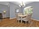 Charming dining area with hardwood floors and a chandelier at 24703 Buckingham Way, Punta Gorda, FL 33980