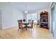 Bright dining room features a glass table set and built-in shelving at 4171 Magenta Ave, North Port, FL 34288