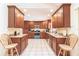 Bright kitchen with granite countertops and stainless steel appliances at 2216 Pellam Blvd, Port Charlotte, FL 33948