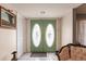 Bright entryway with double doors and elegant seating at 2216 Pellam Blvd, Port Charlotte, FL 33948