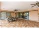 Spacious covered patio with seating area and ceiling fans at 2216 Pellam Blvd, Port Charlotte, FL 33948