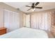Serene bedroom with a queen-size bed and plenty of closet space at 2216 Pellam Blvd, Port Charlotte, FL 33948