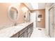 Bathroom boasts double sinks, granite countertops, and a shower at 2216 Pellam Blvd, Port Charlotte, FL 33948