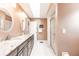 Elegant bathroom with double sinks, granite counters, and a large shower at 2216 Pellam Blvd, Port Charlotte, FL 33948