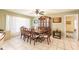 Bright dining room featuring a wooden table and access to kitchen at 2216 Pellam Blvd, Port Charlotte, FL 33948