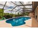 Inviting screened-in pool perfect for relaxation and entertaining at 2216 Pellam Blvd, Port Charlotte, FL 33948
